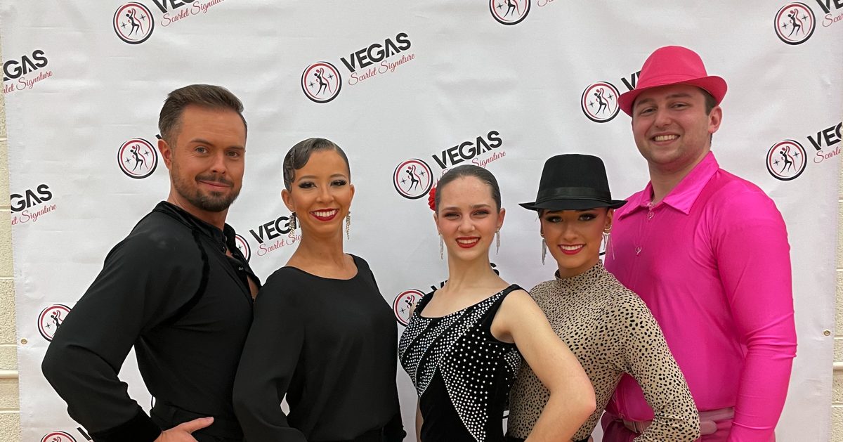 Atlas Dance students performing a synchronized formation routine in competition